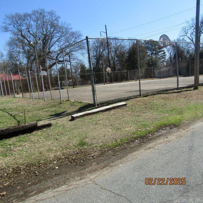 exterior space with community basketball court and fence