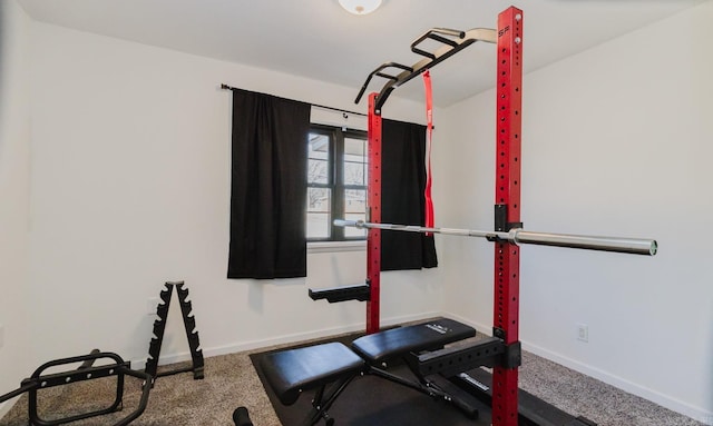 exercise room featuring carpet floors and baseboards