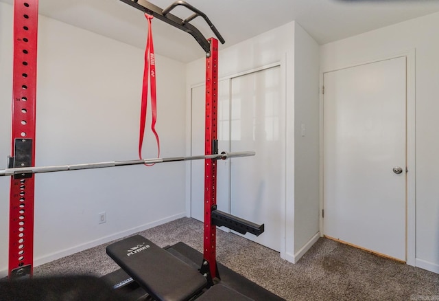 workout area with carpet flooring and baseboards