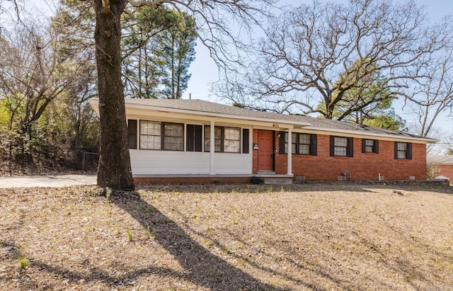 ranch-style house featuring crawl space and brick siding