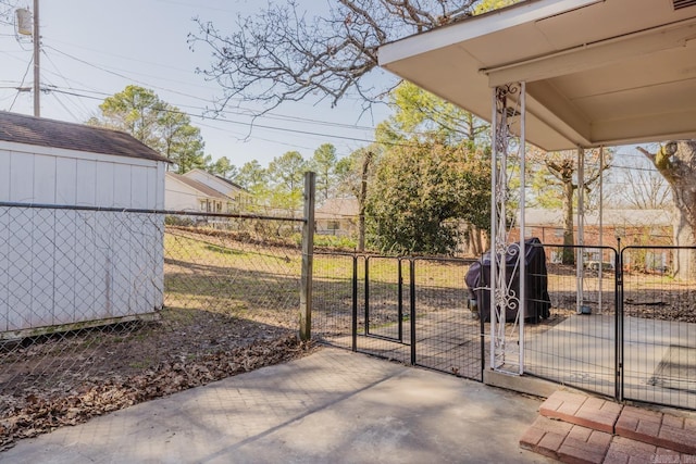 view of patio / terrace with a gate, fence, and grilling area