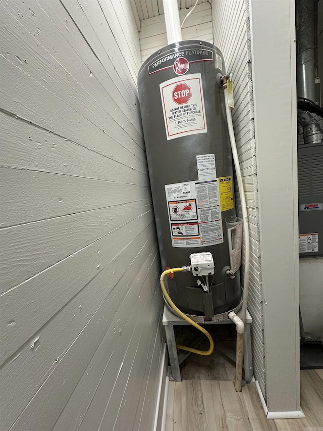 utility room with water heater