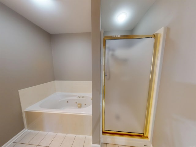 full bath with a shower stall, a whirlpool tub, and tile patterned floors