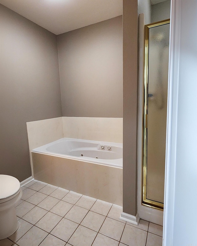 full bathroom featuring a jetted tub, tile patterned flooring, toilet, and a stall shower