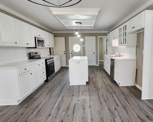 kitchen with stainless steel appliances, light countertops, and glass insert cabinets