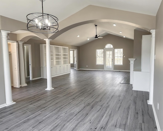 unfurnished living room featuring decorative columns, baseboards, lofted ceiling, ceiling fan, and light wood-style floors