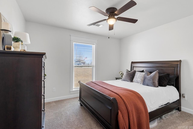 bedroom featuring baseboards, ceiling fan, and light colored carpet