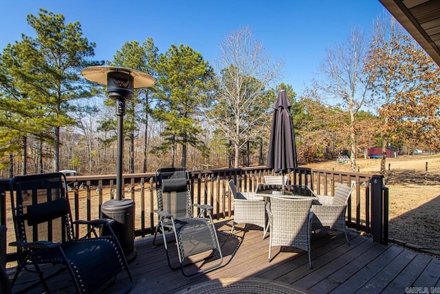 wooden terrace featuring outdoor dining space