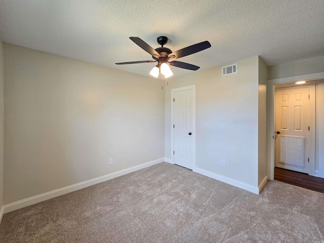 unfurnished bedroom with carpet, a closet, visible vents, and baseboards