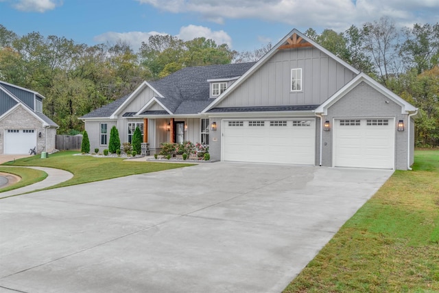 view of front of property with brick siding, roof with shingles, concrete driveway, board and batten siding, and a front lawn