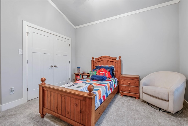 bedroom featuring carpet, a closet, and crown molding