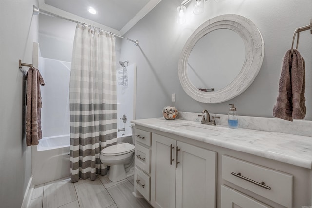 full bath with vanity, toilet, and shower / bath combo with shower curtain