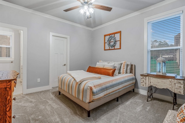 bedroom with ornamental molding, light colored carpet, ceiling fan, and baseboards