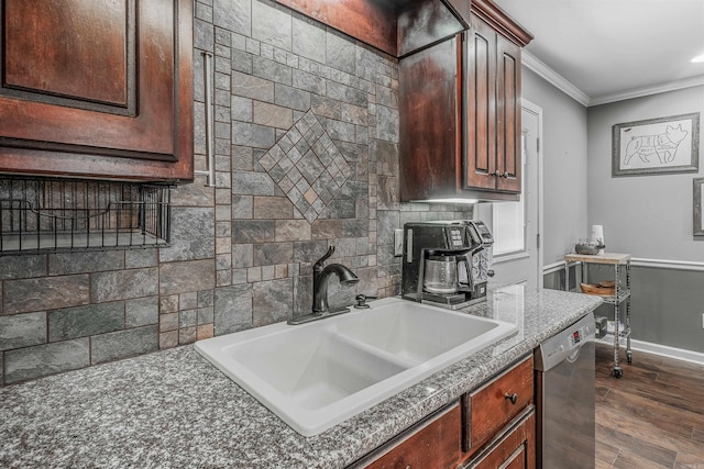 kitchen featuring tasteful backsplash, stainless steel dishwasher, ornamental molding, dark wood-type flooring, and a sink