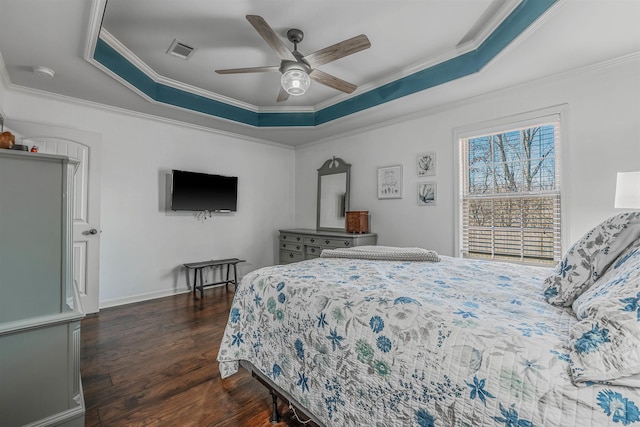 bedroom featuring visible vents, baseboards, ornamental molding, dark wood-style floors, and a raised ceiling