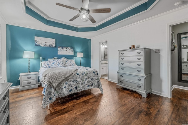 bedroom with baseboards, a raised ceiling, hardwood / wood-style flooring, and crown molding