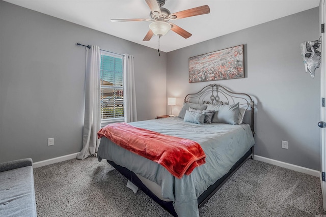 bedroom featuring carpet floors, a ceiling fan, and baseboards