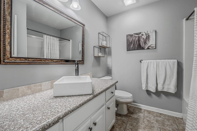 full bathroom with toilet, vanity, baseboards, and a shower with shower curtain