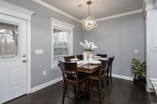 dining room with baseboards, visible vents, dark wood finished floors, and crown molding