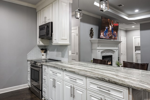 kitchen with electric stove, white cabinets, crown molding, and dark wood-style flooring