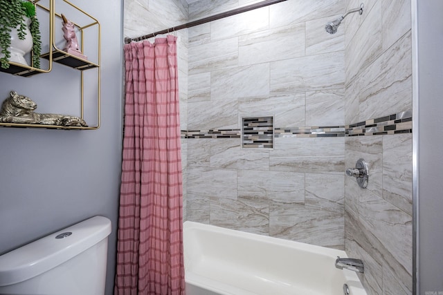 bathroom with shower / bath combo and toilet