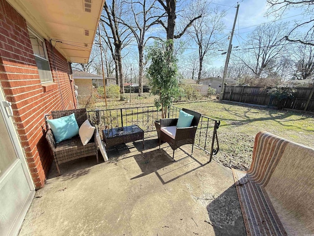 view of patio / terrace featuring fence