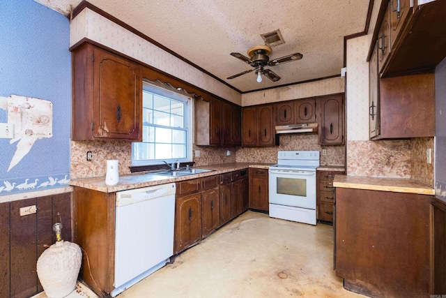 kitchen featuring white appliances, visible vents, light floors, under cabinet range hood, and a sink