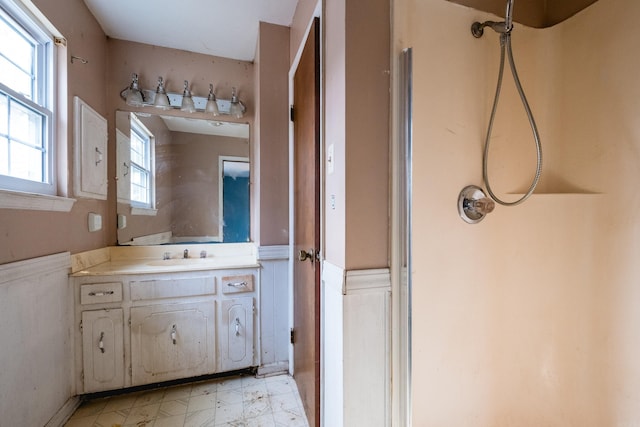 full bath with a shower and vanity