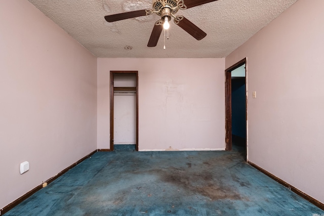 unfurnished bedroom featuring a textured ceiling, carpet floors, a closet, and baseboards