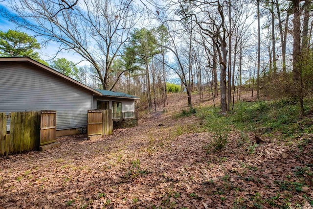 view of yard featuring a wooden deck