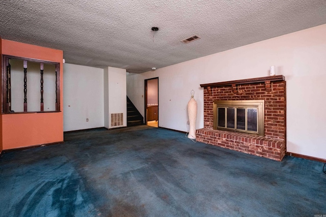 unfurnished living room with a brick fireplace, carpet, stairway, and visible vents