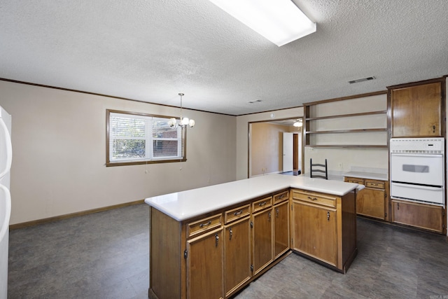 kitchen with white oven, a warming drawer, open shelves, light countertops, and visible vents