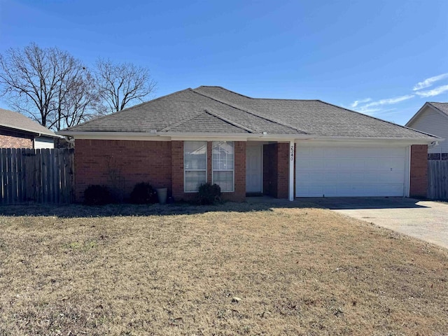 ranch-style house with a garage, brick siding, a shingled roof, fence, and a front yard