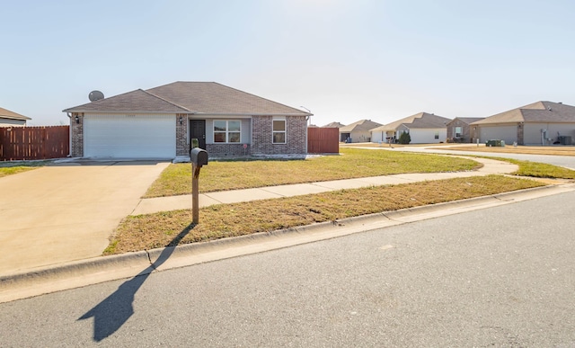 ranch-style house featuring a garage, brick siding, fence, concrete driveway, and a front lawn