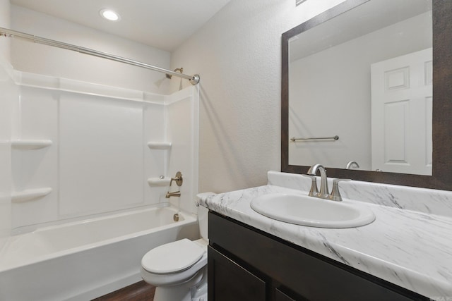 full bathroom featuring toilet, recessed lighting, shower / washtub combination, and vanity