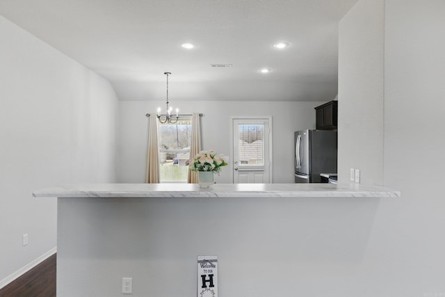 kitchen featuring recessed lighting, dark wood-style flooring, visible vents, baseboards, and freestanding refrigerator