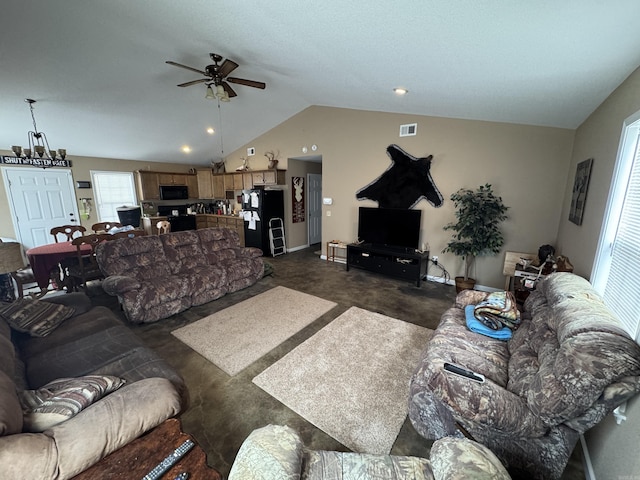 living room with vaulted ceiling, dark carpet, visible vents, and a ceiling fan