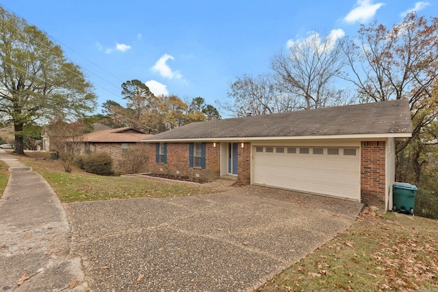 ranch-style house with a garage, concrete driveway, and brick siding