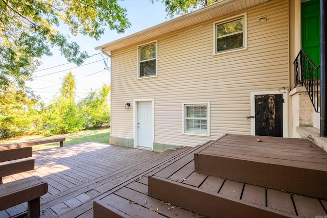 back of property featuring a deck