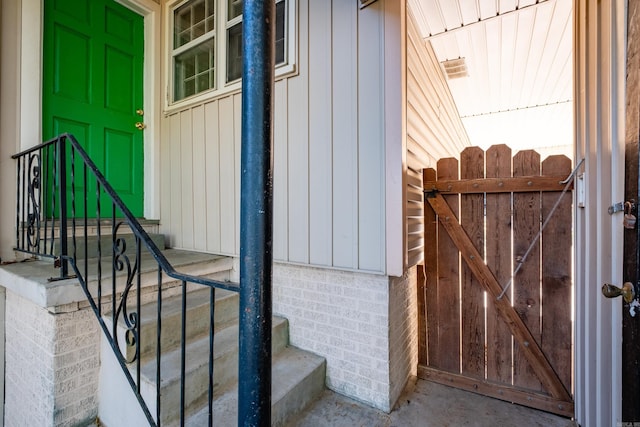 view of exterior entry featuring board and batten siding