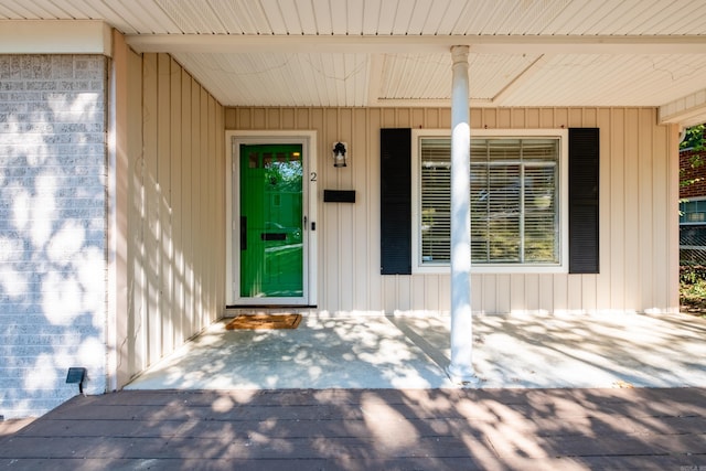 doorway to property featuring covered porch