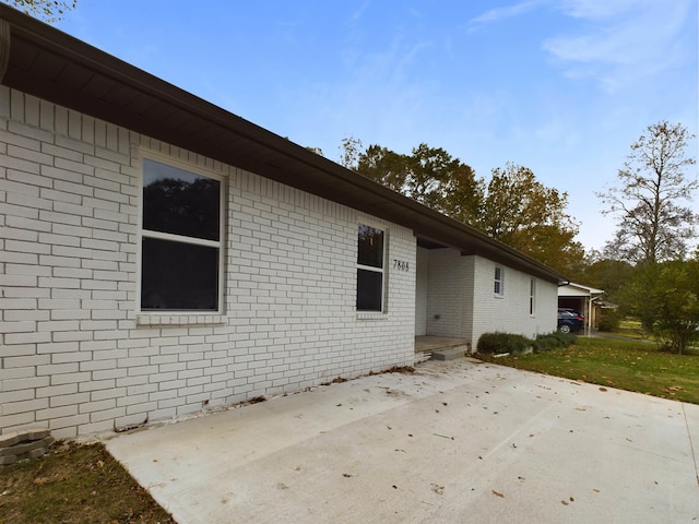 exterior space featuring brick siding