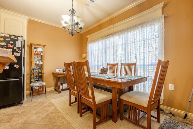 dining room featuring light tile patterned floors, baseboards, visible vents, crown molding, and a chandelier