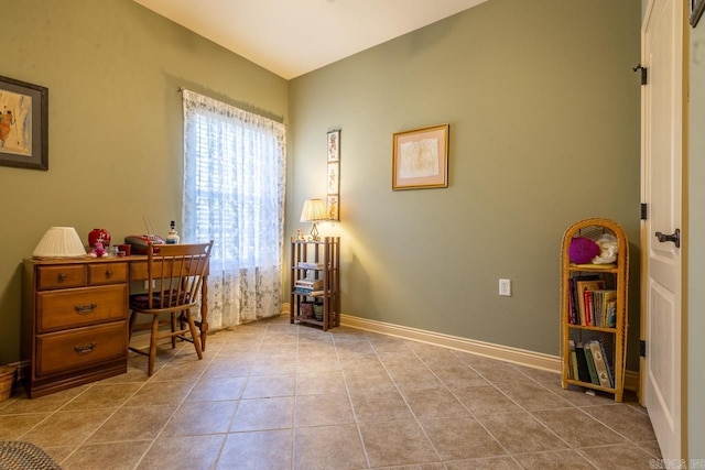 home office with baseboards and tile patterned floors