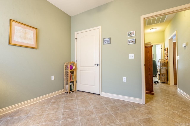 interior space featuring visible vents, baseboards, and light tile patterned floors