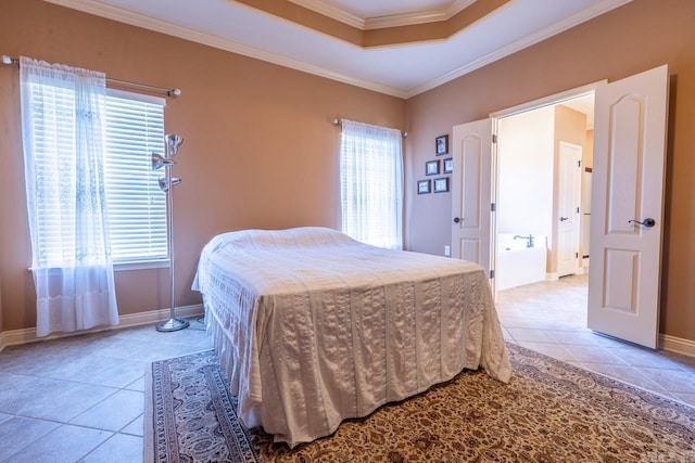 bedroom featuring a tray ceiling, light tile patterned flooring, crown molding, and baseboards