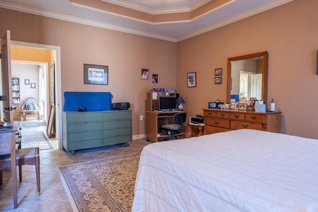 tiled bedroom featuring a tray ceiling and crown molding