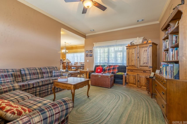 living area featuring ornamental molding, visible vents, light carpet, and ceiling fan with notable chandelier