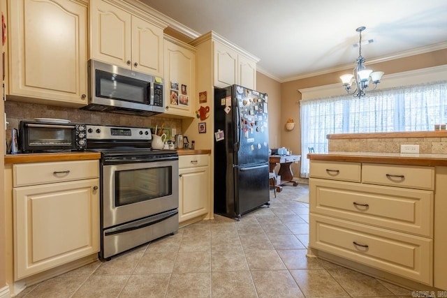 kitchen featuring a toaster, appliances with stainless steel finishes, decorative backsplash, and crown molding