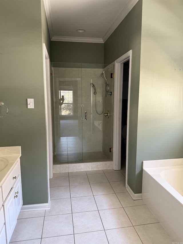 bathroom featuring ornamental molding, a shower stall, vanity, tile patterned flooring, and baseboards